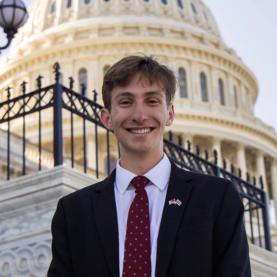 Noah Siegel-Stone standing in front of the capitol